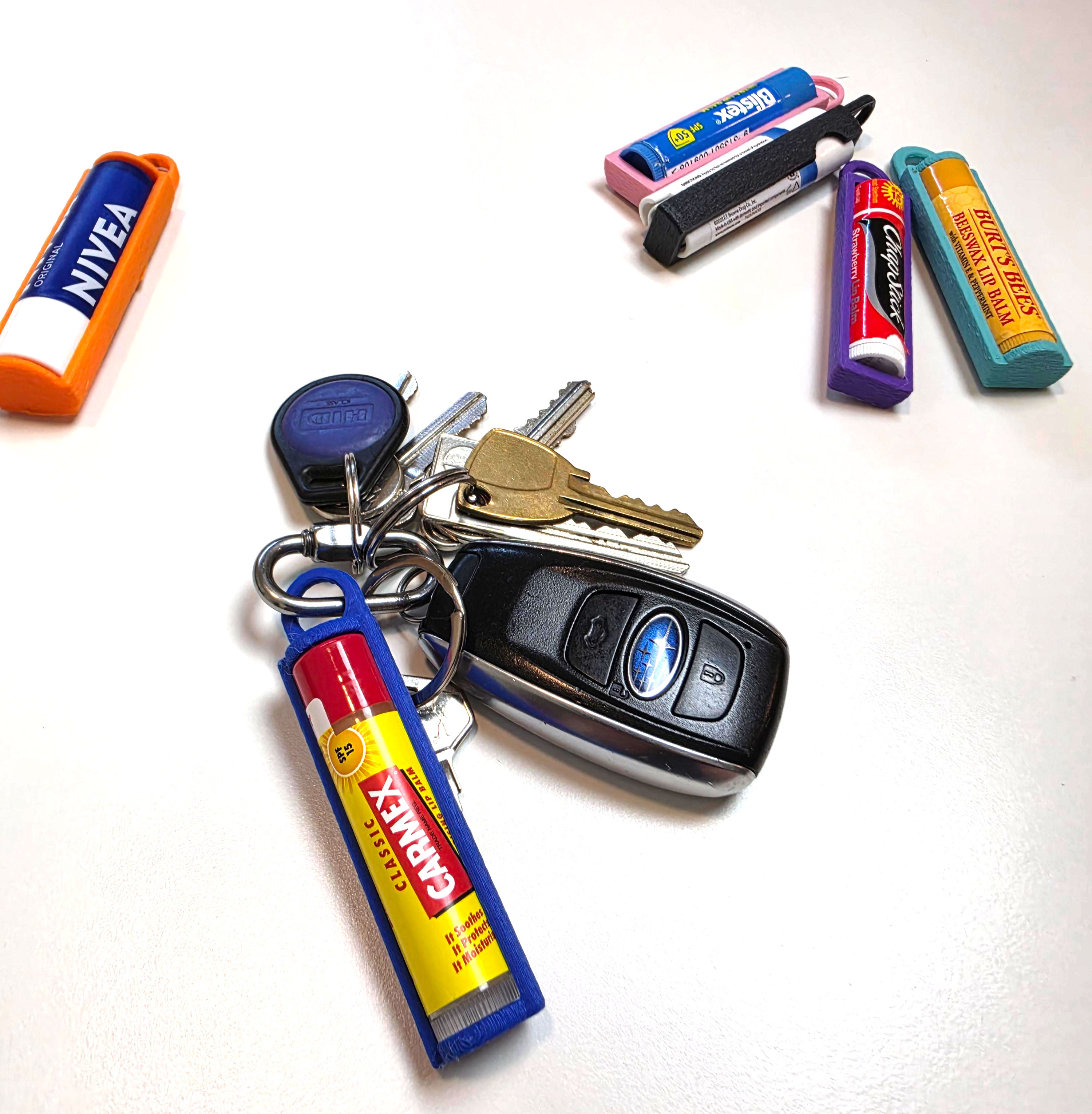 HappyChap chapstick holder clipped to a keychain